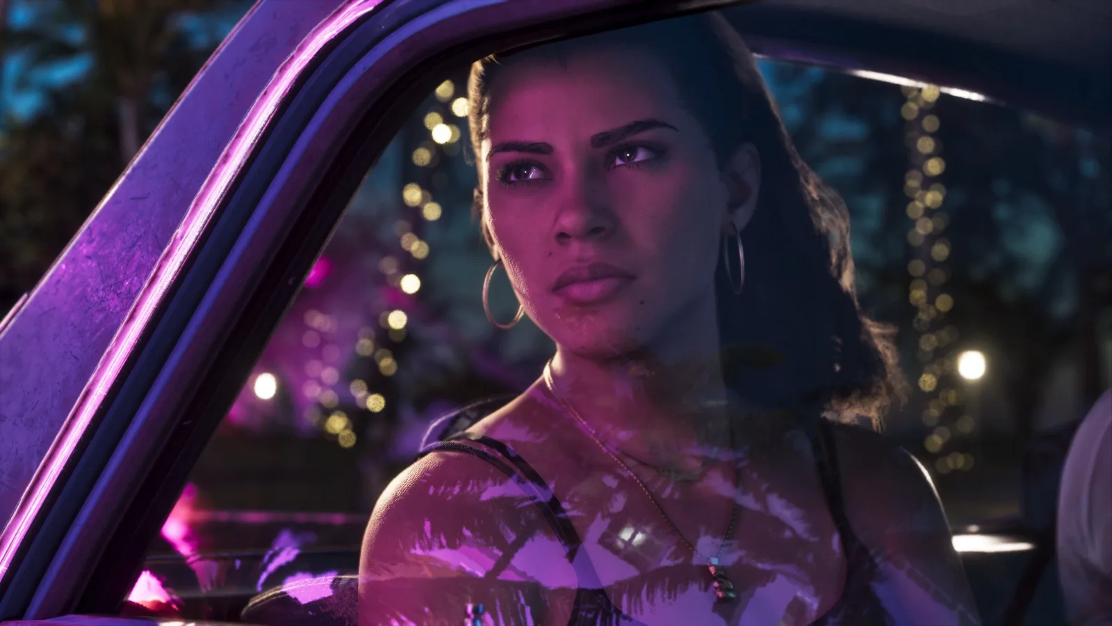 Official GTA 6 screenshot — Lucia at the wheel on a neon-lit street at night (An Extended Look)
