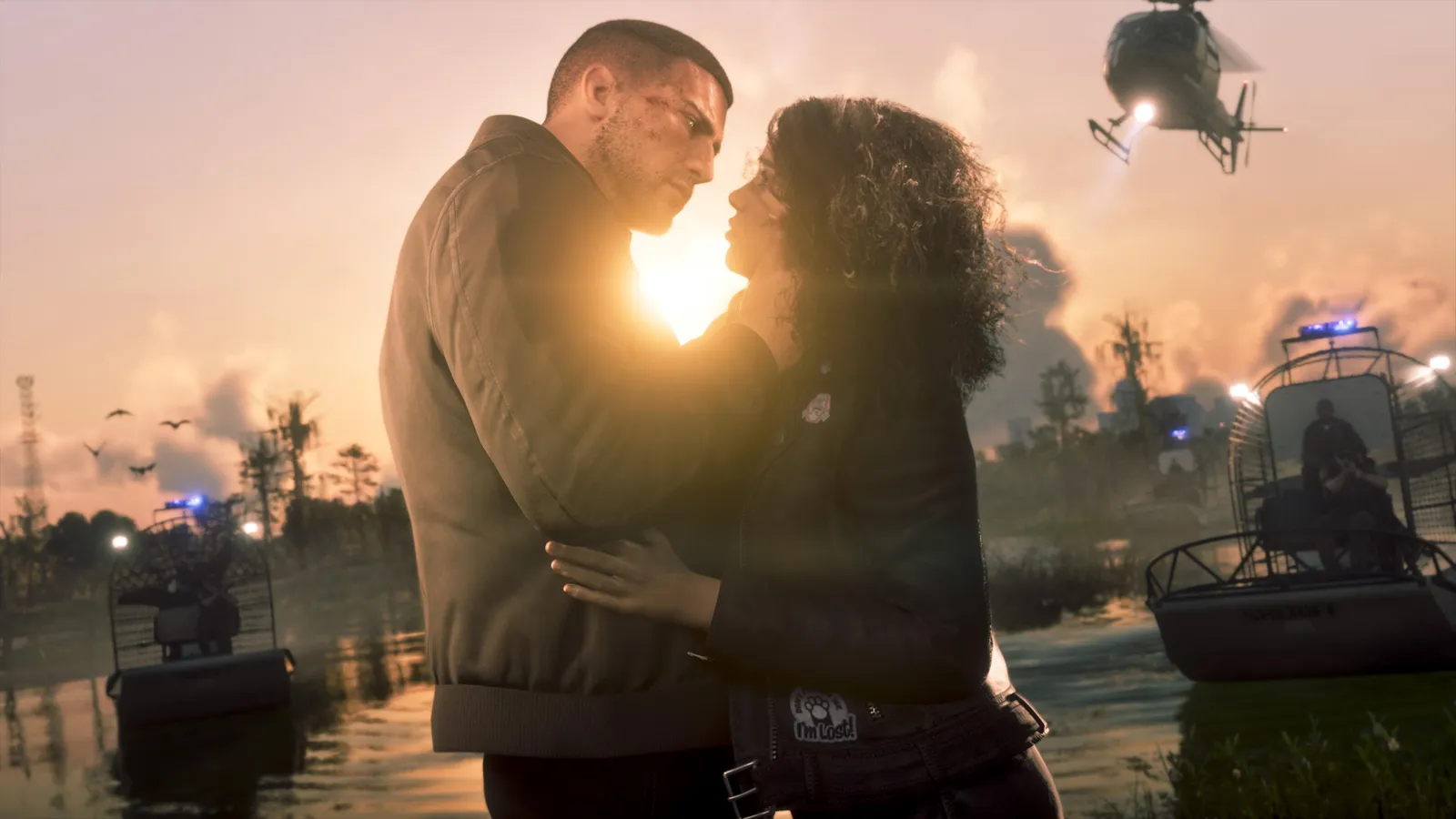 Jason and Lucia embracing in the wetlands as sheriff airboats and a police helicopter close in — official image from An Extended Look