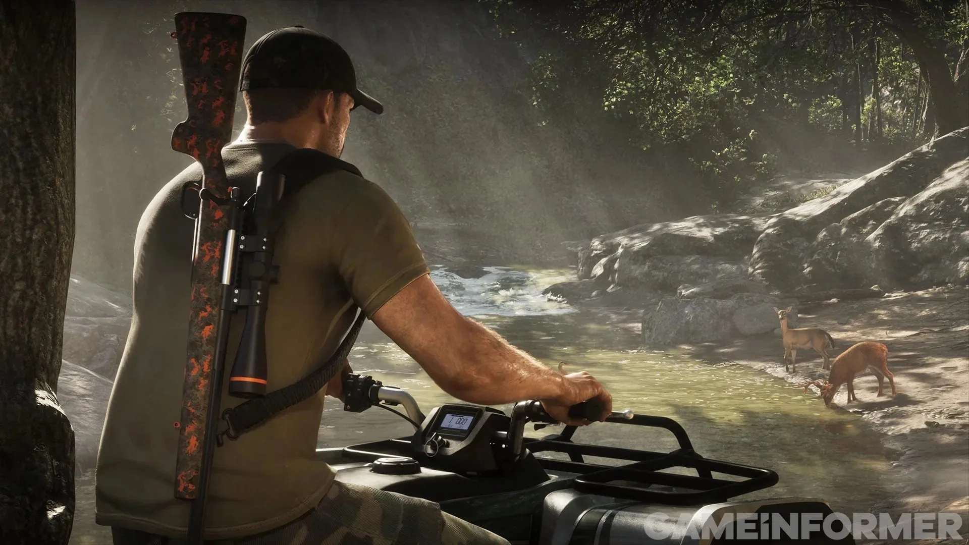 GTA 6 screenshot from Game Informer — a man on a quad bike with a scoped rifle on his back, two deer drinking at a creek