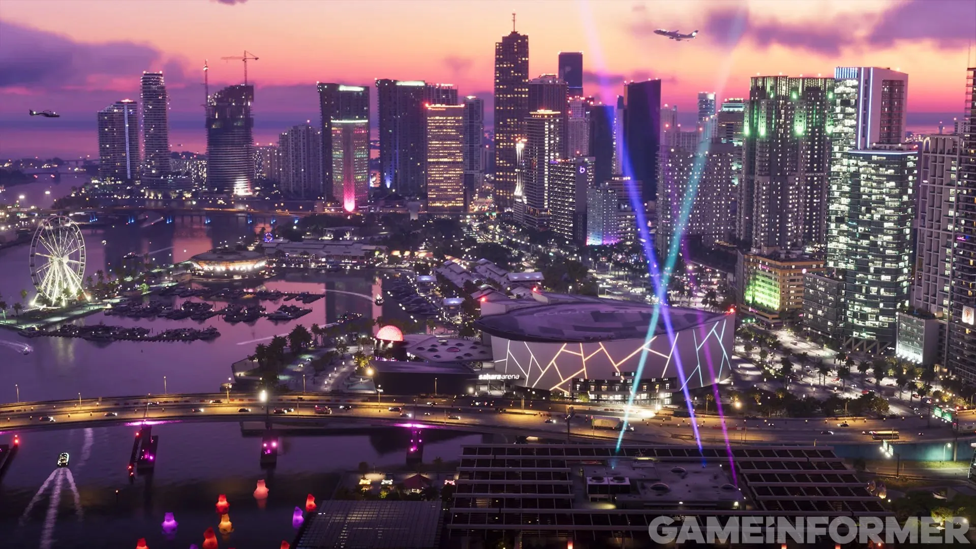 GTA 6 screenshot from Game Informer — Vice City skyline at dusk with a ferris wheel, a marina and an arena