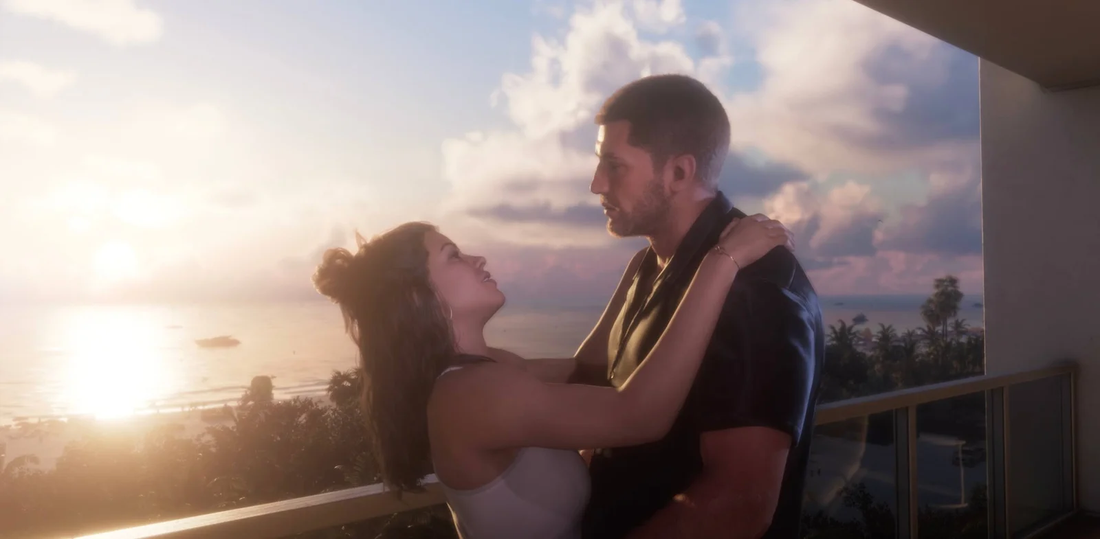Frame from the GTA 6 Launch Trailer: a couple embracing on a balcony at sunset above the sea