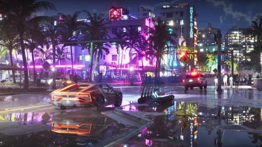 Official GTA 6 screenshot: a sports car on a wet neon-lit boulevard lined with palm trees at night (released October 8, 2026)