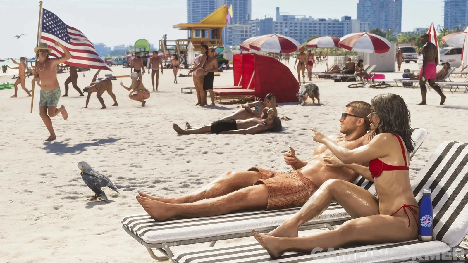 Jason and Lucia on sun loungers on a crowded Vice City beach, a new screenshot from Game Informer issue 382 (Rockstar Games)